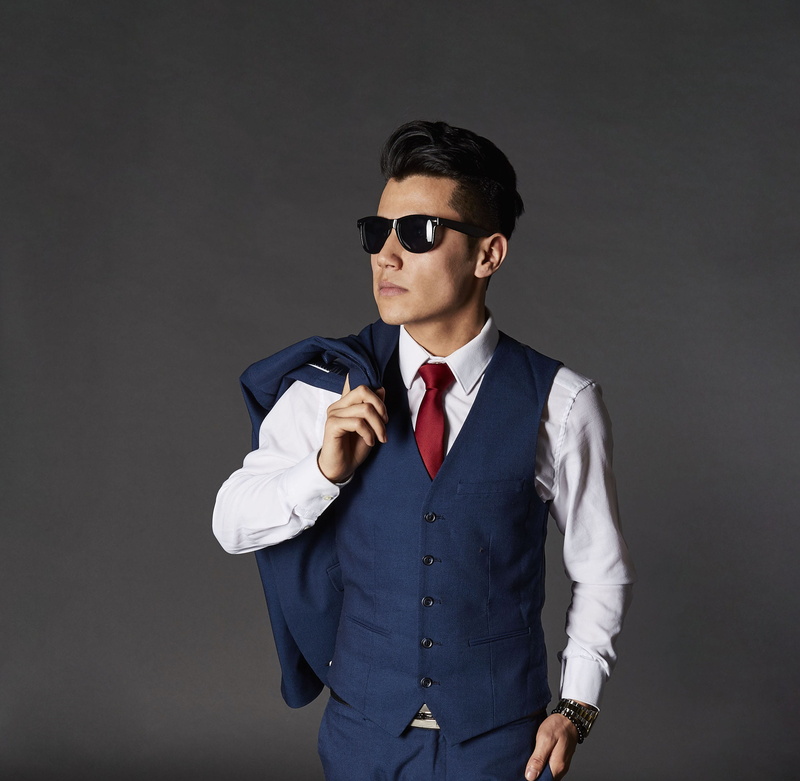 man, black background, studio, model, business, outfit, facial expression, standing, formal, 2K, person, menswear, portrait, professional occupation, face