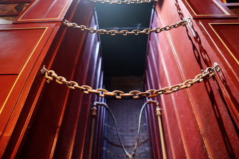 strength, no people, day, links, safe, chain, walls, metal, door, steel, secured, chains, container, red, building, hanging, law, rope, punishment, tied up