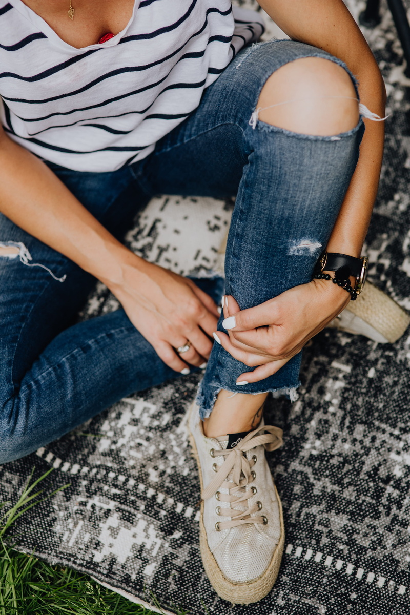 textile, necklace, human body part, young, jewelry, female, indoors, pants, stylish, low section, leisure activity, tan, sitting, legs, fashion, gold, accesories