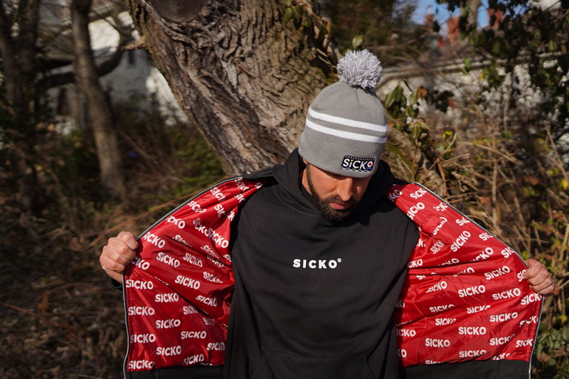 neck, clothing, woodland, shirt, day, black, wearing, outdoors, jacket, style, trunk, real people, waist up, adult, wear, nature, beanie, t, plant, headwear