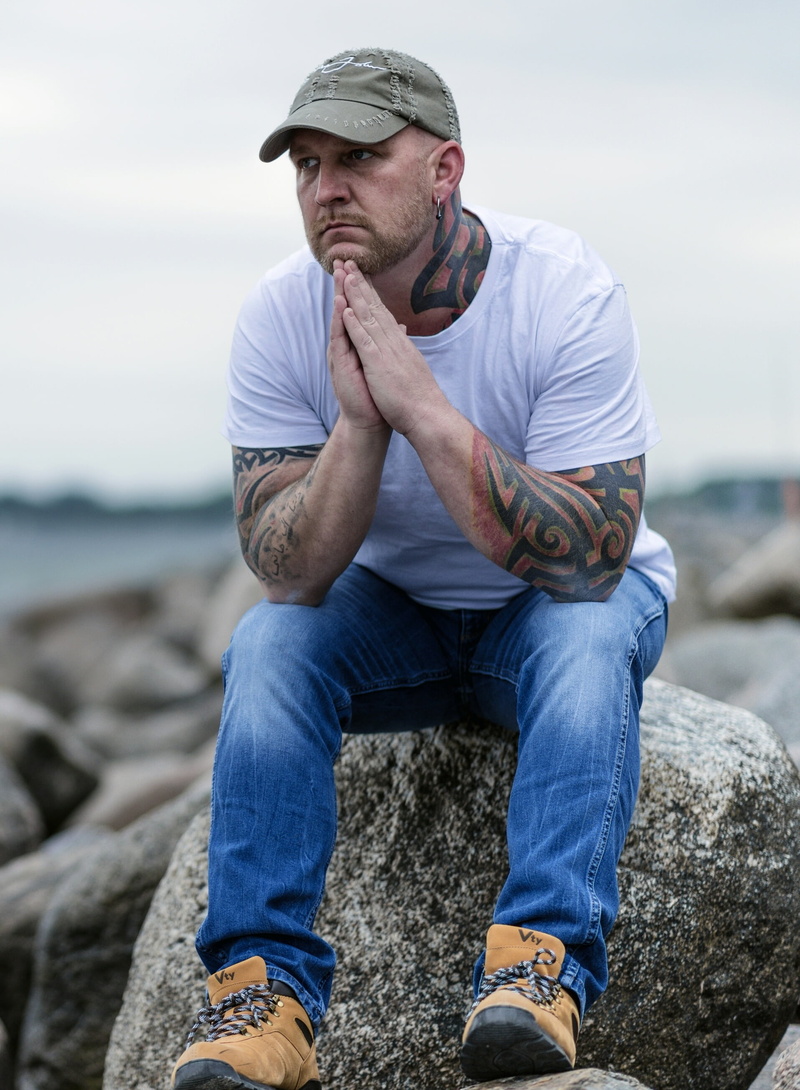 nature, one Man Only, rock - object, rock, outdoors, denim, psyche, man, crew, caucasian Ethnicity, clouds, sad, jeans, tattoo, front view, people, men
