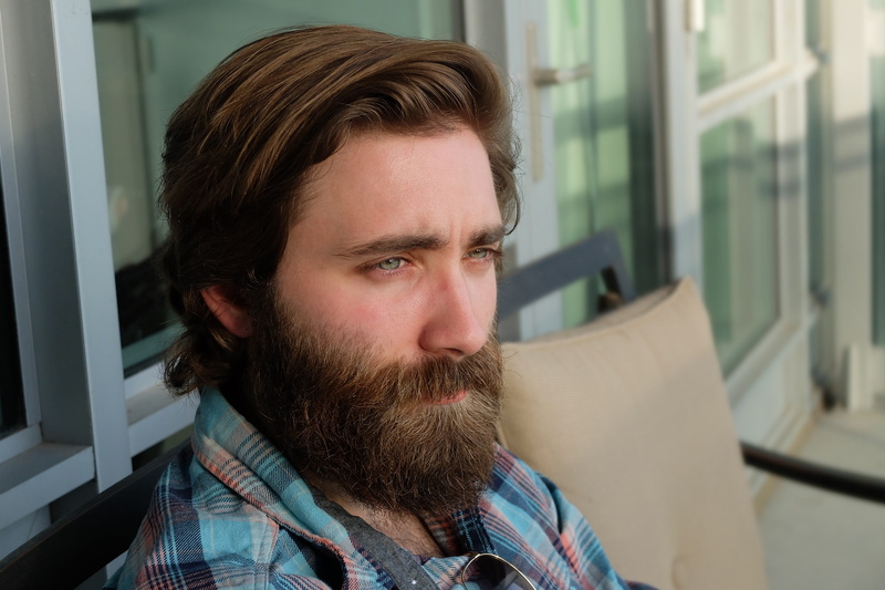 young Adult, men, caucasian Ethnicity, wearing, beard, plaid, facial Hair, one Person, indoors, male, focus on foreground, teal, eye, real people, lifestyles