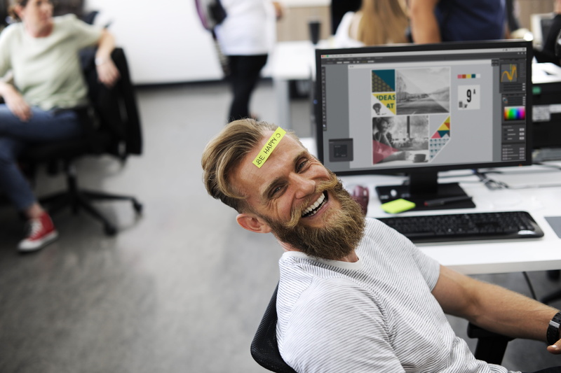 office, break, crew-neck, startup, focus on foreground, sticky note, T-shirt, relaxation, laughing, shirt, smiling, sitting, happiness, business person