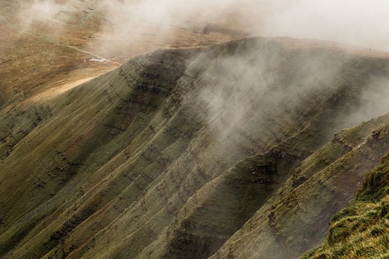 mesa, non-urban scene, road, mountain range, no people, outdoors, hot spring, angle, volcanic crater, field, mountain, remote, river, hill, beauty in nature