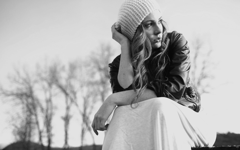 monochrome, standing, scarf, focus on foreground, warm clothing, lifestyles, portrait, leisure activity, looking into the distance, outdoors, cold temperature