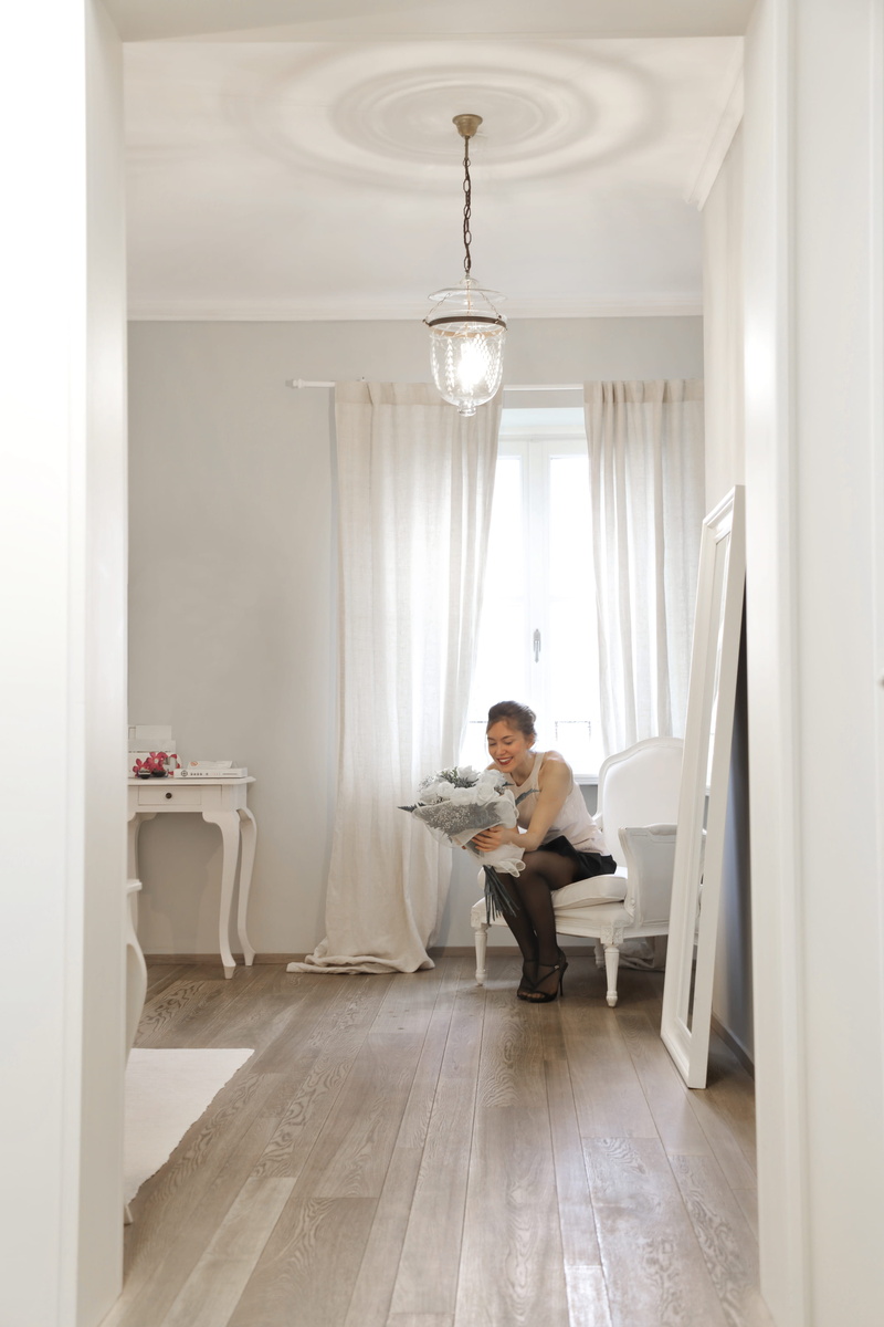 home interior, beautiful, interior, hardwood floor, beauty, adult, one person, room, white, casual clothing, holding, home, design, floor, curtain, architecture
