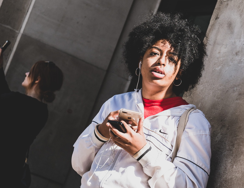 woman, afro hairstyle, casual clothing, united kingdom, adult, women, wireless technology, listen, looking at camera, 4K, technology, african american