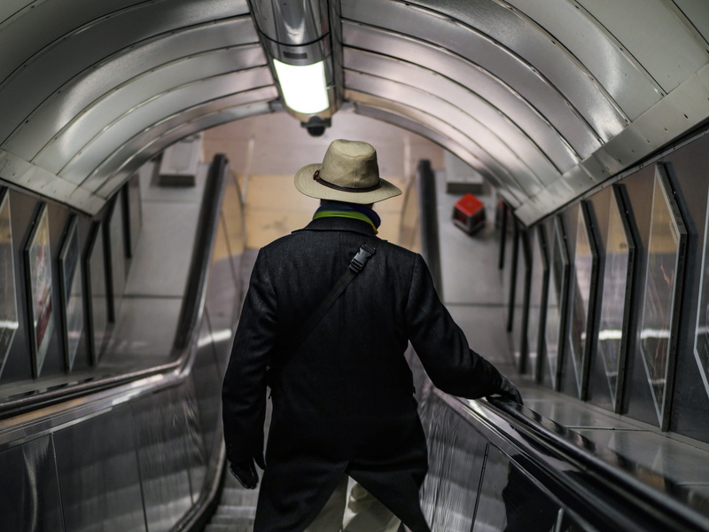 round, subway station, vehicle, one person, handrail, rail transportation, male, terminal, coat, riding, united kingdom, ceiling, train, london, 5K, real people