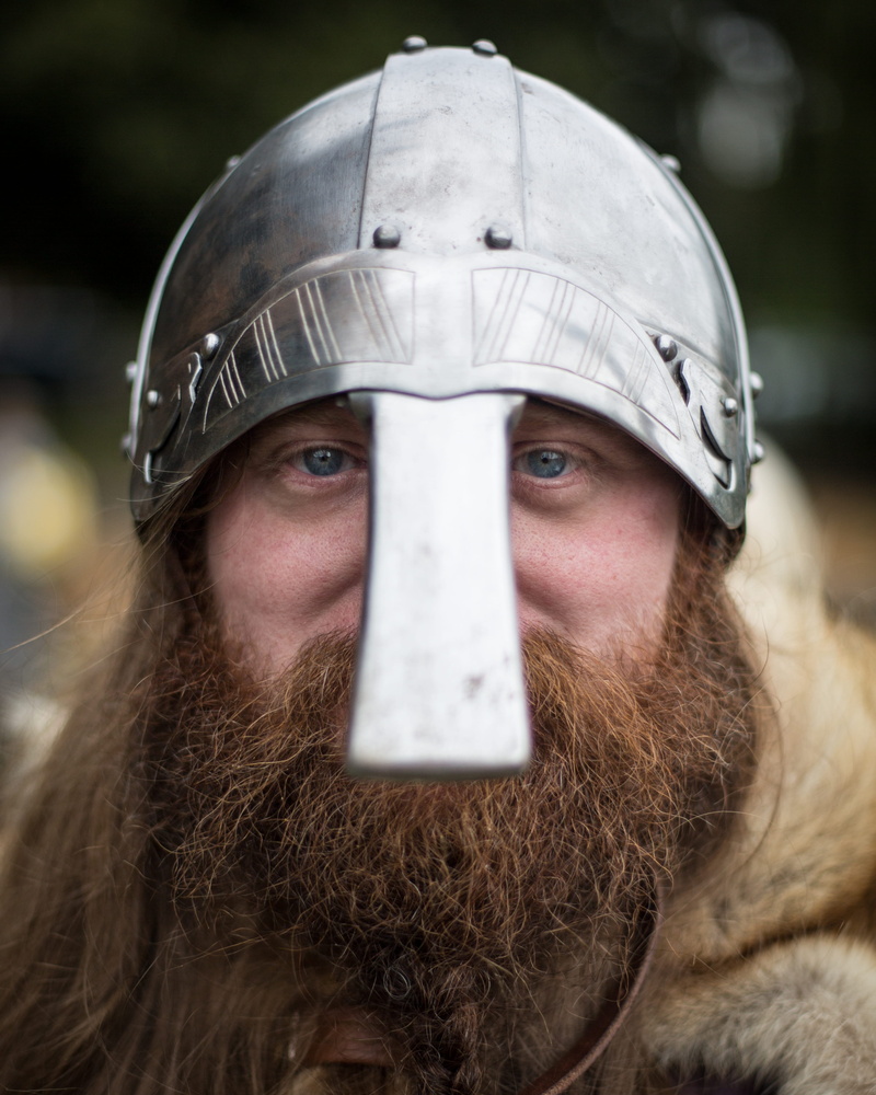 human, one person, photo, blue eyes, man in a costume, looking at camera, baseball cap, helmet, costume, clothing, people, viking, beard, close-up, sport