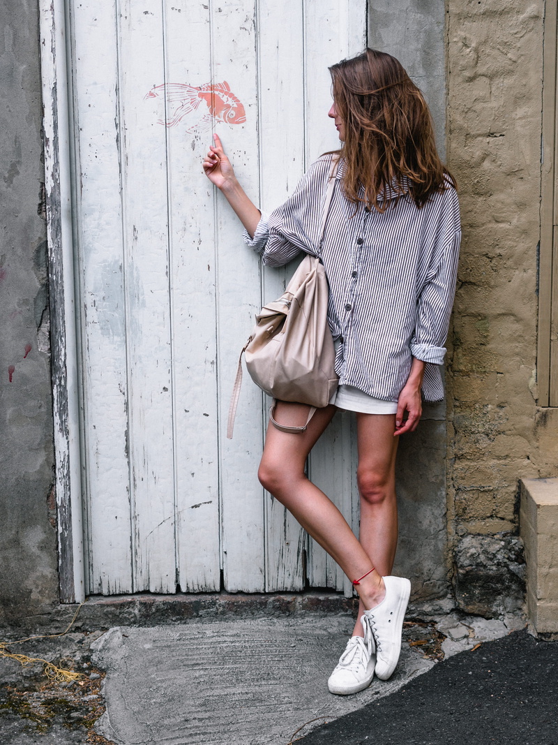 day, blond hair, women, woman, young, standing, hairstyle, daylight, youth, facial expression, one person, hair, female, shoe, hands, graffiti, fashionable