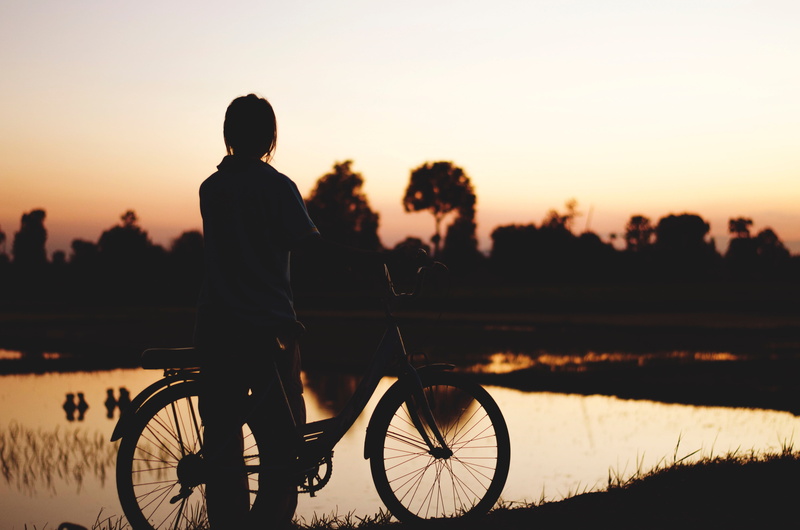 outdoor, real people, sport, land vehicle, orange color, transportation, travel, cycling, adults only, leisure activity, plant, lifestyles, men, dark, mode of transport