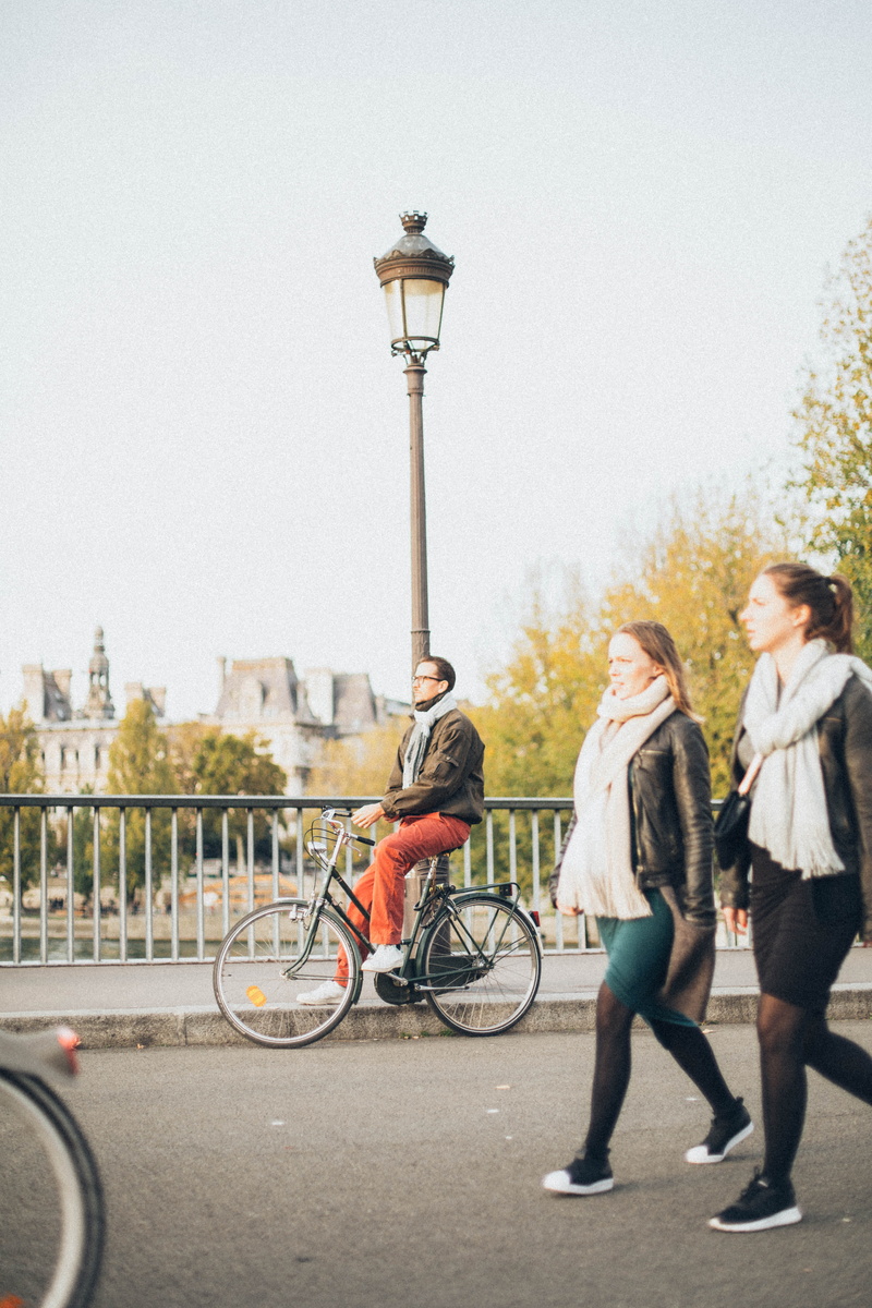 post, street, street light, bike, building exterior, leisure activity, architecture, transportation, adult, action, woman, vehicle, mode of transportation