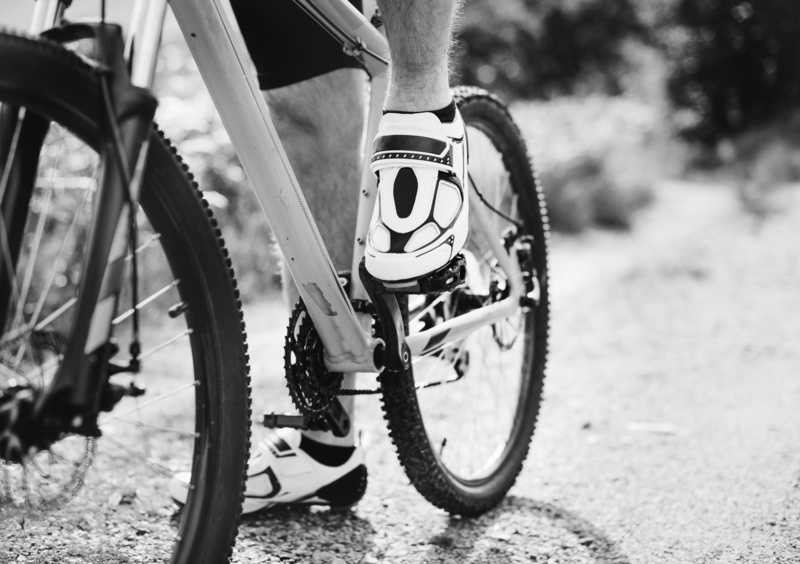 low section, one person, human foot, fitness, biking, ready, man, tire, close-up, activity, wheels, sport, men, ride, black and white, human leg, mountain bike
