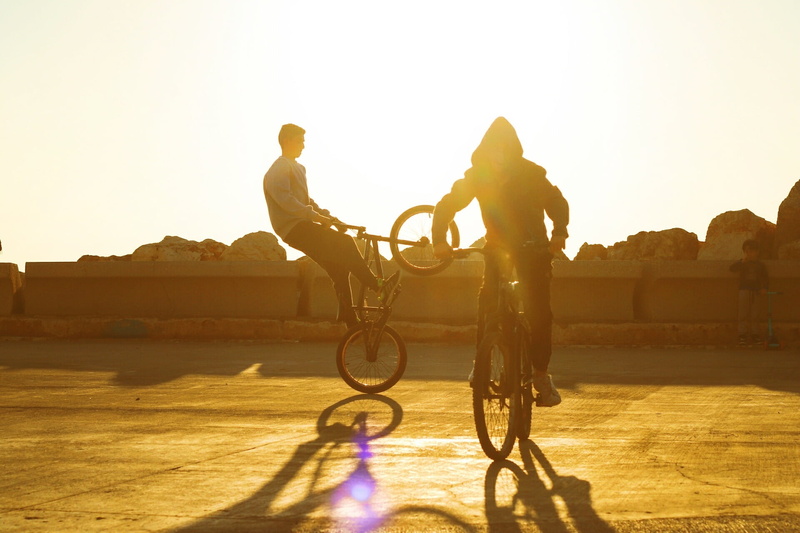 tricks, outdoors, ride, road, sunlight, travel, white, icon, nature, style, bike, silhouette, outdoor, cyclist, people, wheel, sky, leisure, symbol, lens flare
