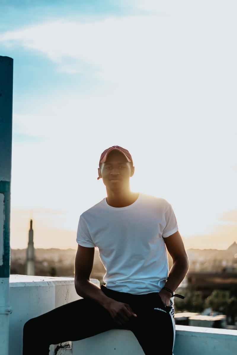 looking away, three quarter length, men, day, transportation, nature, real people, wearing, crew, contemplation, sunlight, fitted, casual clothing, white