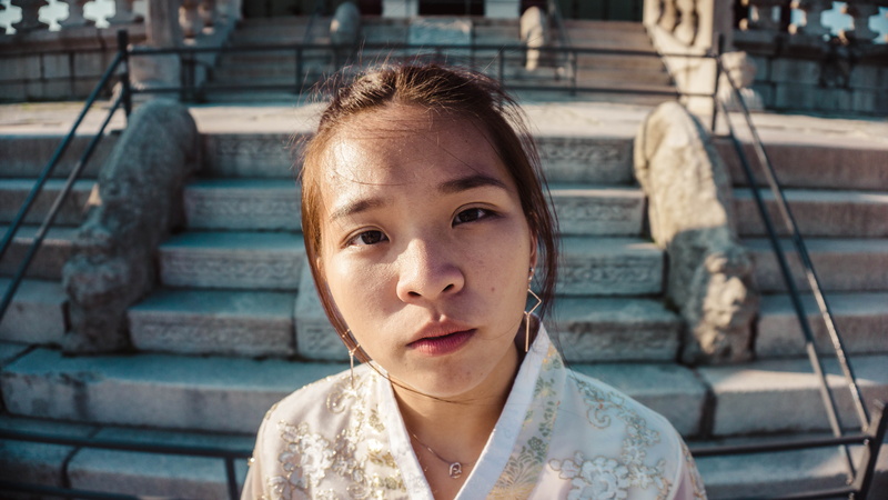 one person, asian woman, girl, day, hairstyle, human, architecture, concrete, built structure, person, standing, outdoors, stairs, child, innocence, asian