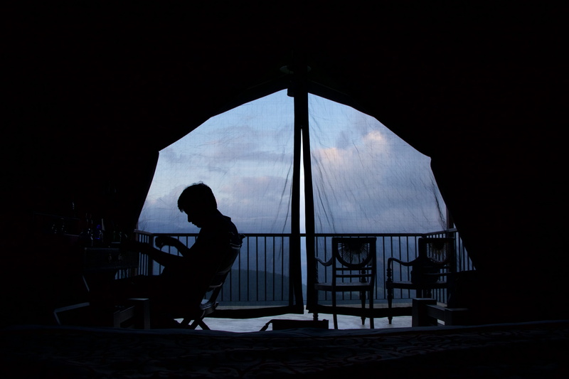 women, leisure activity, on chair, silhouette, one person, sitting, inside, grills, unrecognizable person, veranda, real people, standing, tent, hand, adult