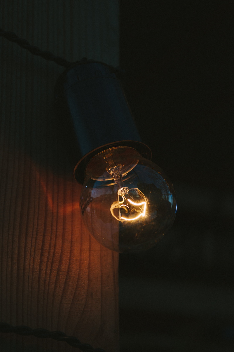 darkroom, music, indoors, day, wood - material, reflection, table, illuminated, no people, lamp, evening, glass, still life, energy, black background, spotlight