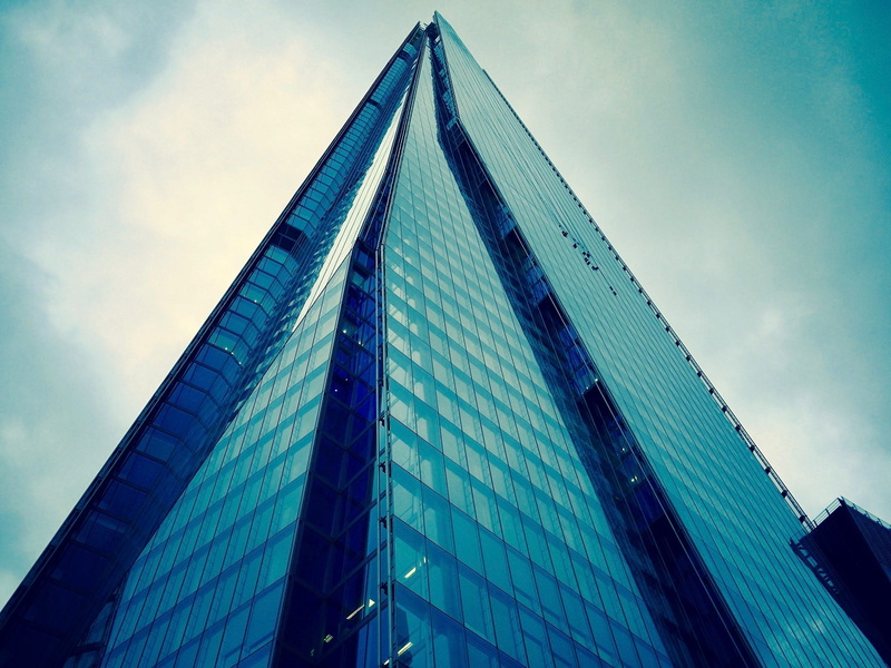 triangle shape, city, building exterior, office building exterior, no people, glass - material, glass, business, famous, cloud - sky, tall - high, blue