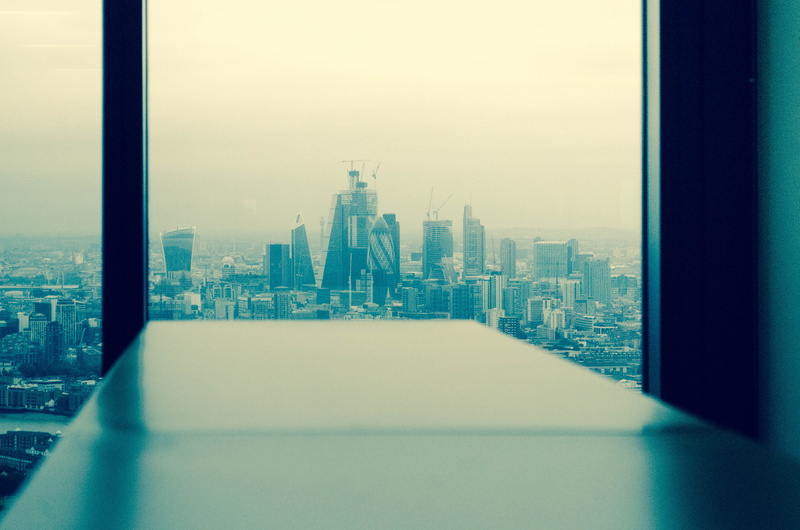 office, skycrapper, nature, office building exterior, cityscape, skyline, building, window, focus on background, no people, table, architecture, outdoors