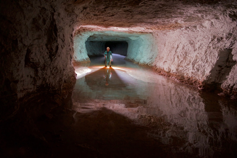 travel, rock - object, flood, potholing, tourism, leisure activity, water, cave, rock formation, lifestyles, full length, men, real people, gallery, one person
