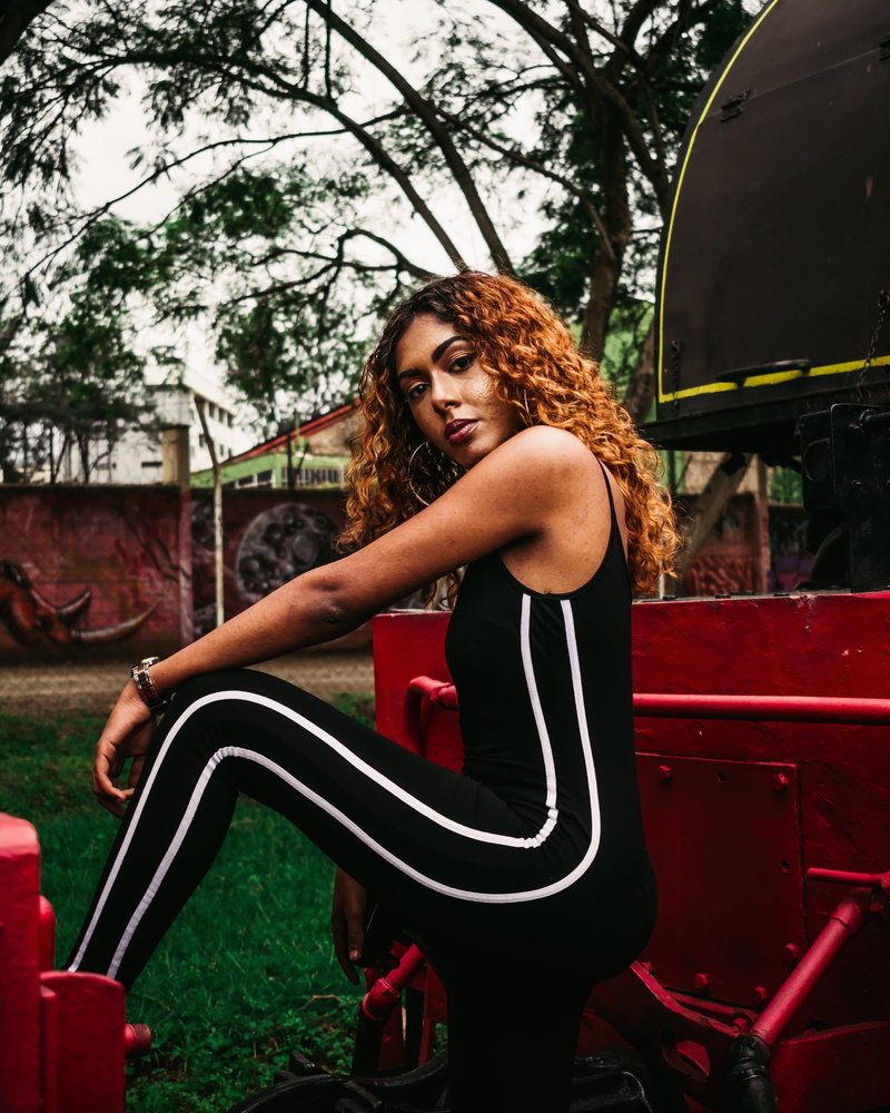 young adult, nairobi, brown hair, real people, day, sitting, women, hairstyle, lifestyles, young women, three quarter length, hair, kenya, beauty, portrait