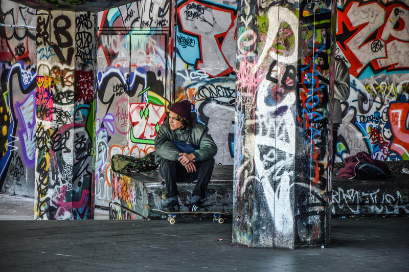 jacket, young adult, lifestyles, art and craft, bench, multi colored, creativity, guy, wearing, skateboard, london, hip hop, sitting, male, one person