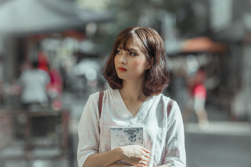 contemplation, beautiful girl, casual clothing, city, young adult, focus on foreground, front view, day, selective, holding, one person, looking, vietnam women