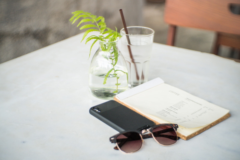 table, clubmaster, beside, book, simple, glass, focus on foreground, paper, text, no people, food and drink, covered, chair, high angle view