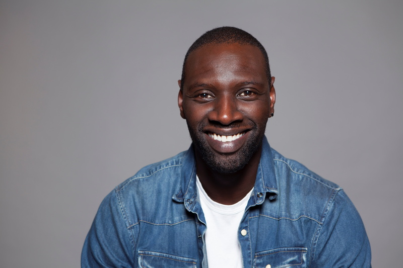 casual clothing, front view, 5K, beard, men, omar sy, young adult, gray, confidence, studio shot, looking at camera, young men, portrait, happiness, emotion