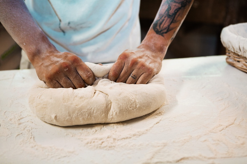 croissant, man, human, one person, indoors, dinner, meal, bakery, pastry, human hand, stuffing, supper, hand, human body part, dessert, dough, culinary
