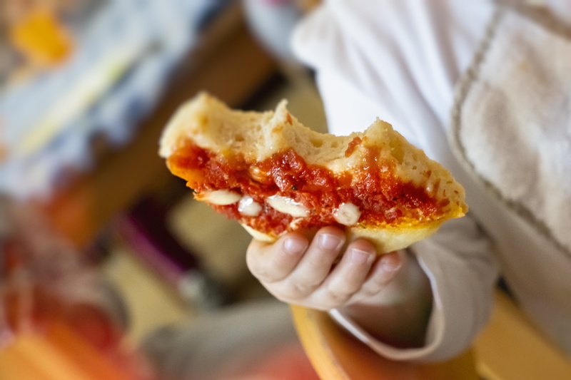 dip, one person, italia, dumpling, culinary, freshness, focus on foreground, drink, ravioli, close-up, kid eat pizza, midsection, sommacampagna, human hand