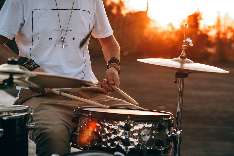 sport, leisure activity, empty clothing, playing, hand, standing, front view, fire - natural phenomenon, holding, drummer boy, men, sunset, drumstick, fire