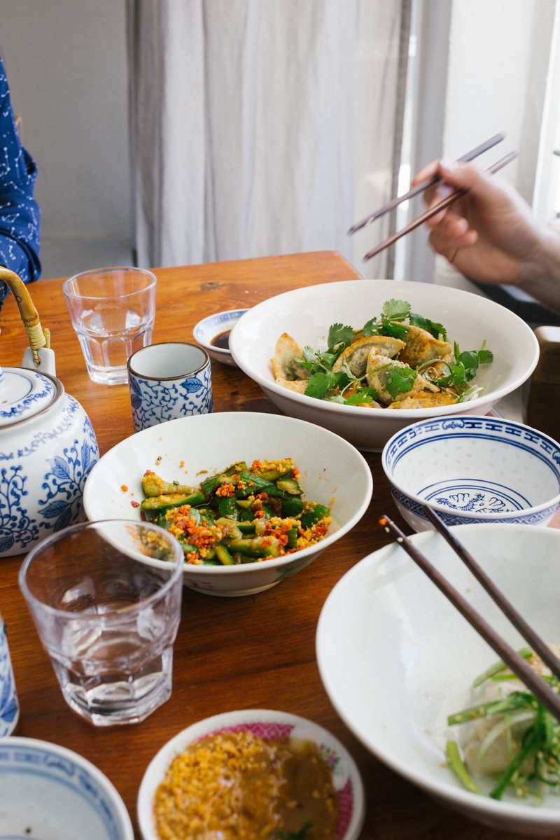 lifestyles, wellbeing, dining table, dim sum, indoors, seasoning, pottery, 5K, meal, table, chinese restaurant, eating utensil, dish, bowls, person, hand