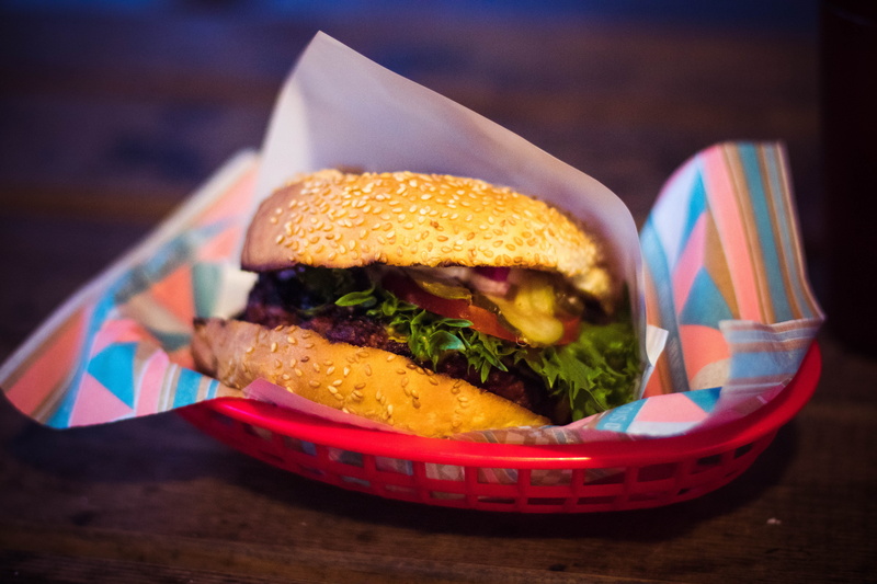 food and drink, meal, indulgence, table, tasty, sandwich, blurred background, food, cheeseburger, delicious, no people, freshness, red, bun, close-up, lettuce