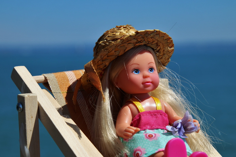 wood - material, holiday, nature, girls, rubber, day, blue eyes, representation, charming, women, blonde, portrait, real people, blue sky, doll, innocence
