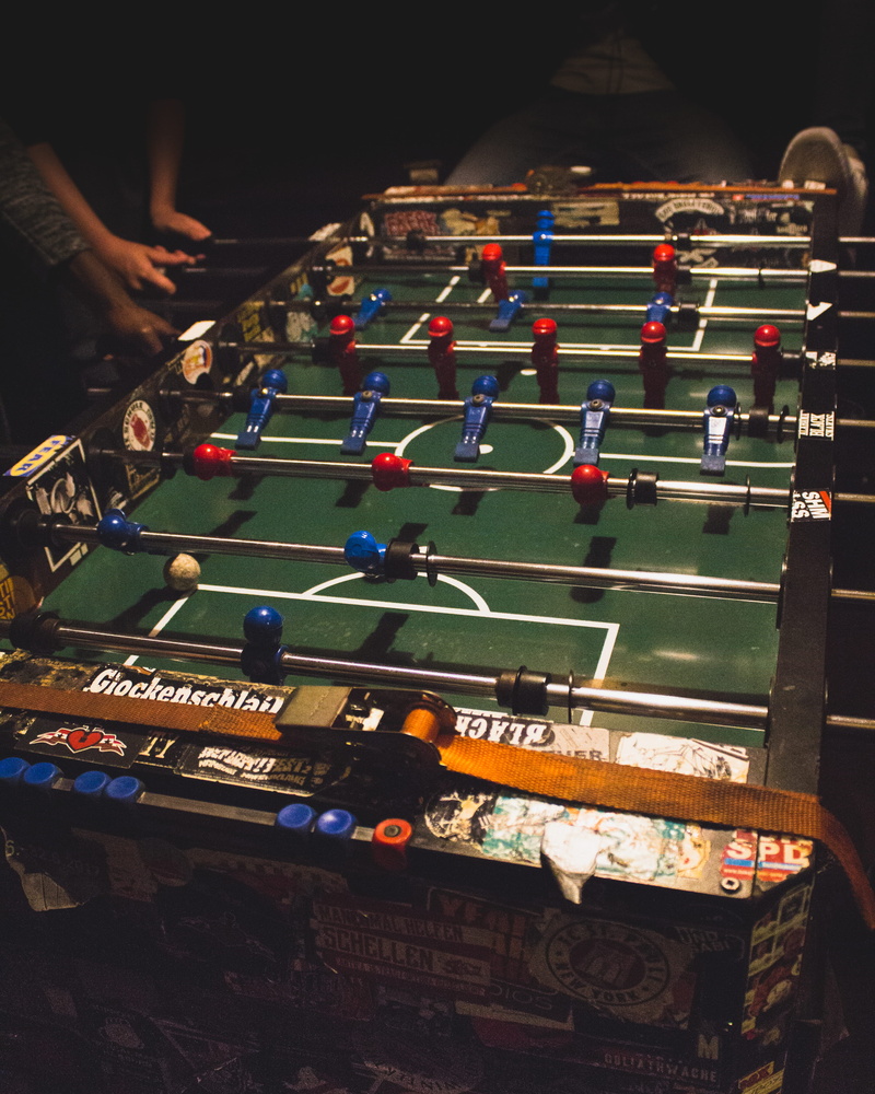 indoors, dark, 4K, foosball, soccer, high angle view, playing, people, st. pauli, leisure activity, night, table, game, human hand, team sport, large group of objects