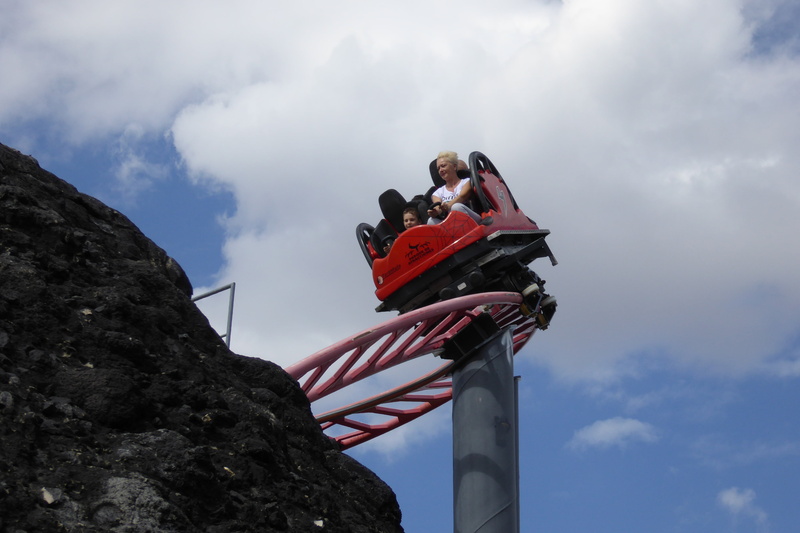 speed, blue, mid adult, roller coaster, cloud - sky, amusement park, standing, real people, clouds, family, mountain, have a good time, climbing, communication