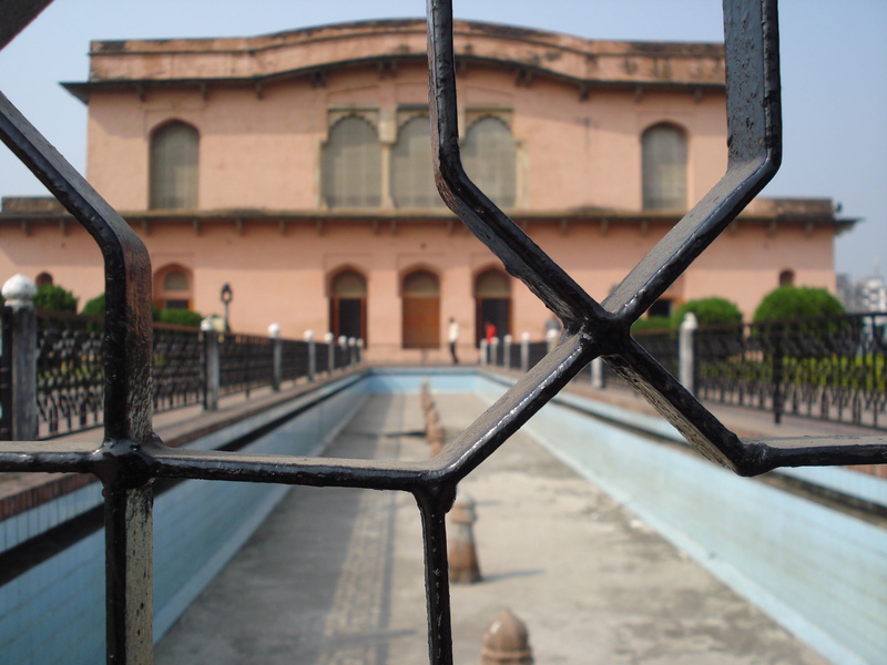 building, outdoors, river, railing, bridge, sky, connection, bridge - man made structure, fence, 2K, lalbagh fort, no people, building exterior, focus on foreground