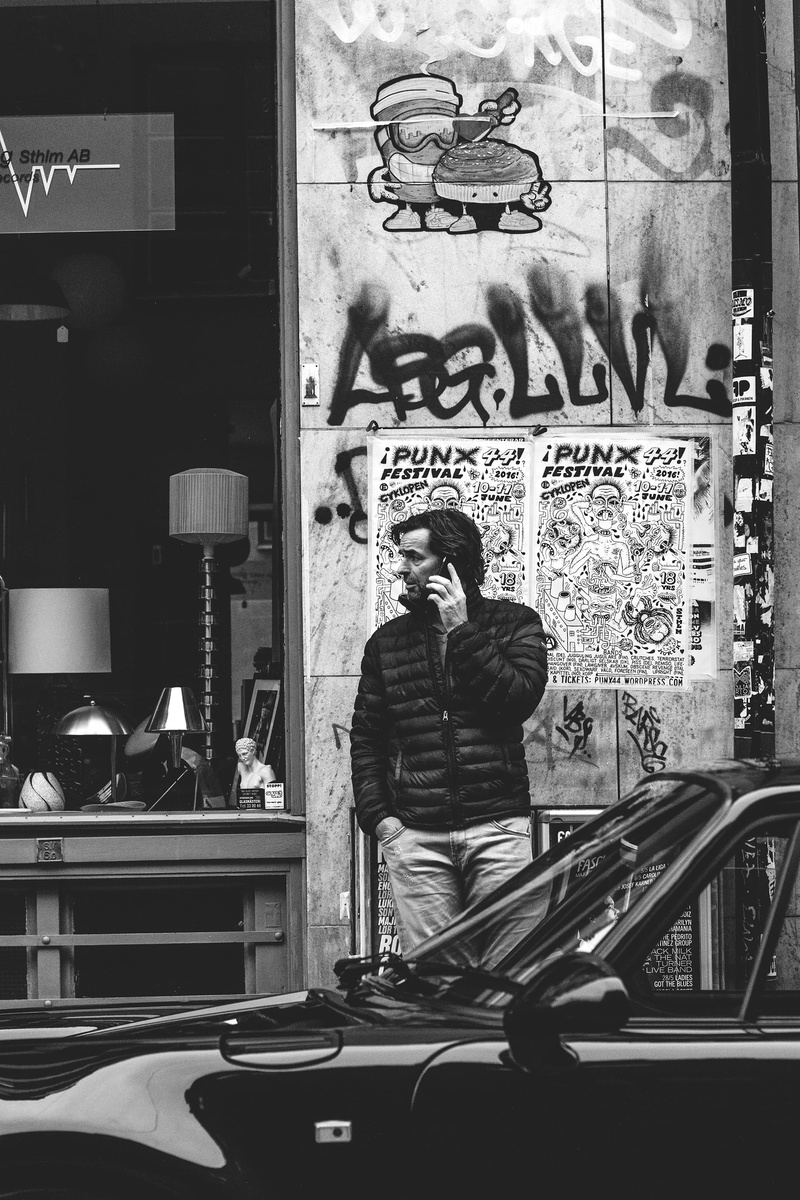 motor vehicle, shop, indoors, graffiti, phone, street, text, men, barber, real people, photography, person, bandw, reflection, glass - material, city, land vehicle