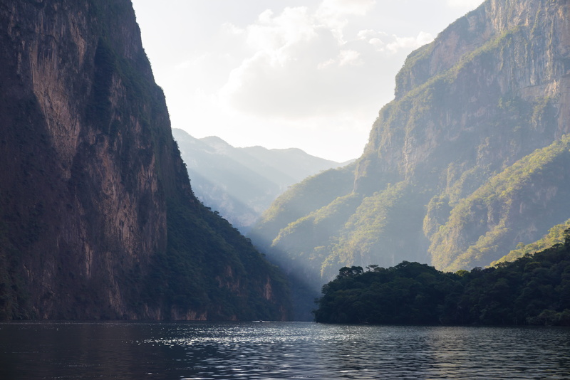 mountain range, soft light, river, water, nature, rock formation, boat tour, rock - object, grijalva river, sun beams, tranquil scene, sumidero canyon