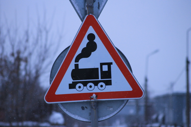 nature, road, icon, street, warning sign, red, communication, sky, focus on foreground, sign, snowing, triangle shape, snow, information, guidance, shape