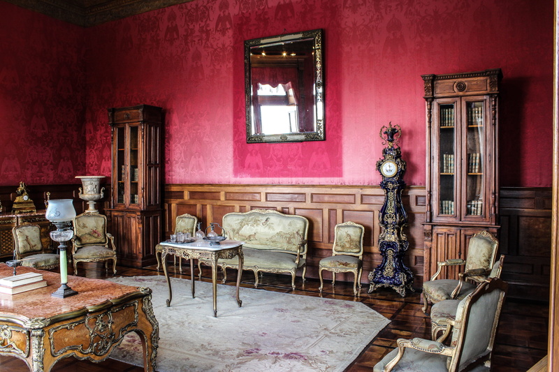waiting room, picture frame, couch, rug, wall - building feature, electric lamp, architecture, old, interior design, mirror, living room, built structure