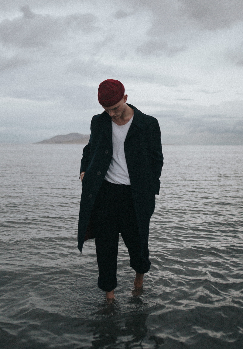 waterfront, young adult, cloud - sky, person, clothing, day, cloud, outdoors, cloudy, ripple, leisure activity, sea, wet, black, standing, walking, real people
