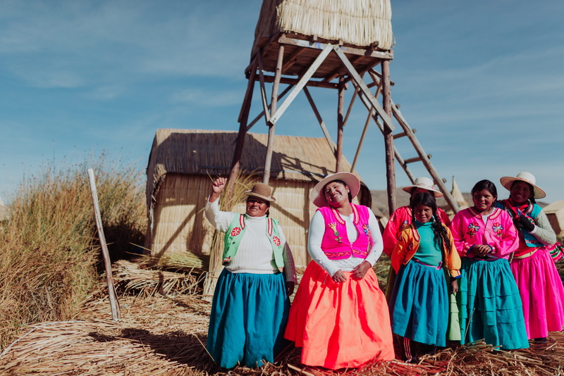 house, wood - Material, outdoors, floating islands, people, love, traditional clothes, tower, grass, women, wave, near, child, females, culture, indigenous Culture