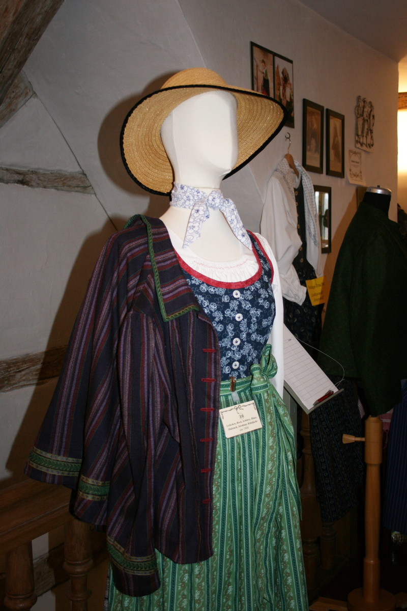bavarian, one person, colorful, leisure activity, headwear, costume market, lifestyles, shopping, clothing, retail display, business, fashion, indoors