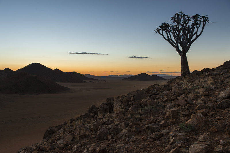 land, desert, mountain, remote, nature, travel, mood, rock - object, mountain range, tranquil scene, climate, sunset, solid, non-urban scene, beauty in nature