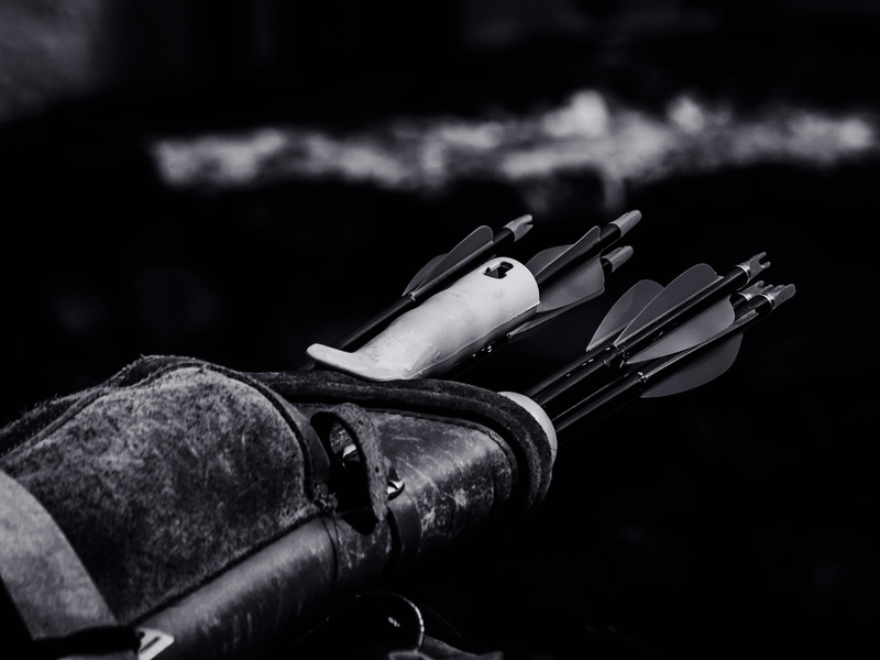 black background, safety, still life, close-up, gun, nature, metal, archery, grayscale, indoors, security, focus on foreground, day, arrows, single object