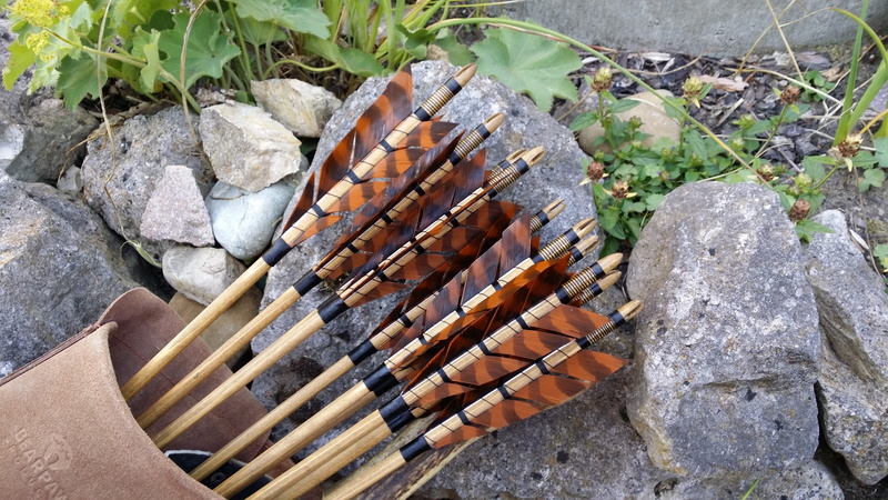 quiver, solid, log, firewood, forest, archery, nature, large group of objects, no people, wood, tree, arrows, stack, objectives, sport, outdoors, rock