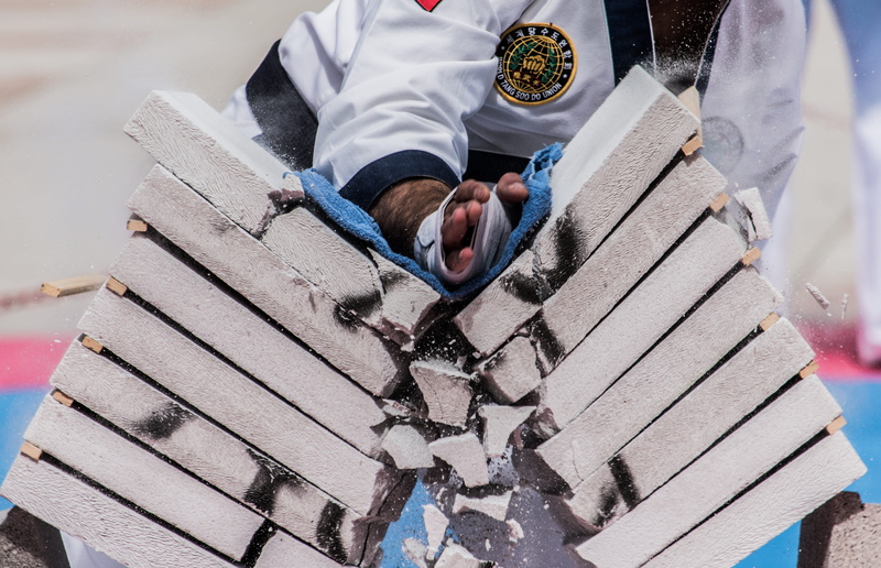 kungfu, person, two people, wood - material, occupation, hand, men, adult, pile, nature, outdoors, martial arts, holding, blocks, takekundo, close-up, working